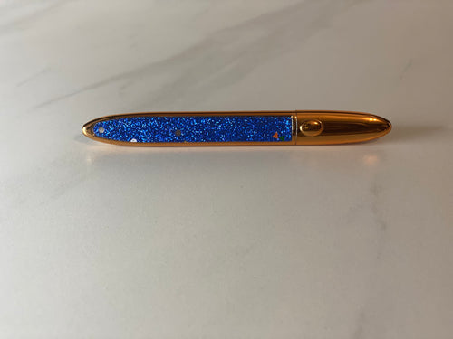 blue glitter with gold top eyelash glue and liner